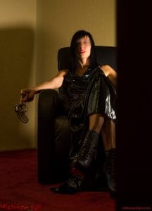 mistress kym is waiting for her slave showing his chastity belt and keeping the key on her
